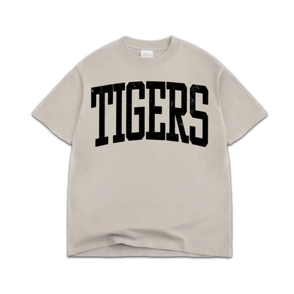 Oversized beige streetwear t-shirt with bold black TIGERS varsity graphic on front