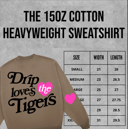 Brown heavyweight cotton sweatshirt with 'Drip loves the Tigers' graphic and size chart on concrete background.