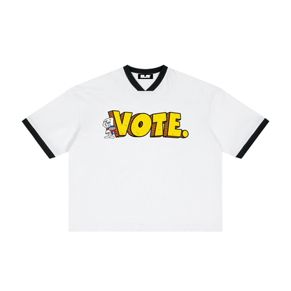 white ringer T-shirt with black trim and a bold yellow 'VOTE.' graphic across the chest,