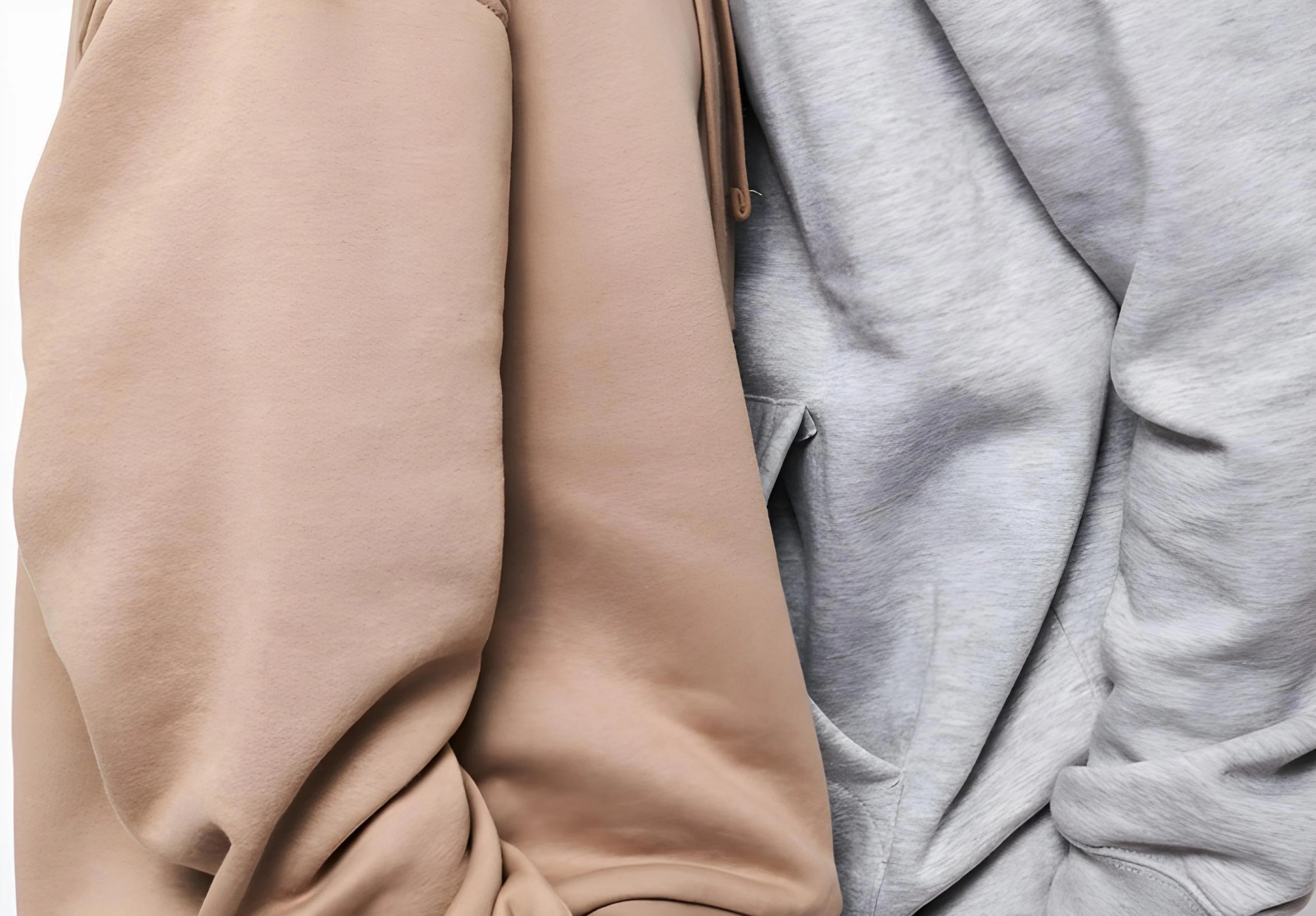 Beige and grey oversized streetwear sweats with soft fabric texture close-up